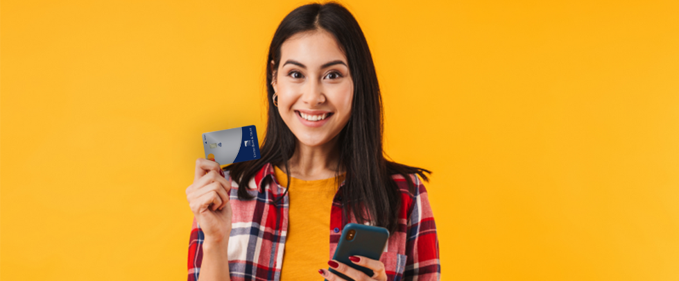 Woman with debit card and phone